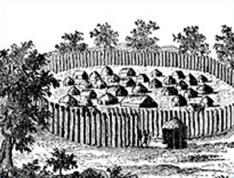 Popolazioni native negli
                "USA": villaggio Abenaki con recinzione a
                picchetto (palizzata)