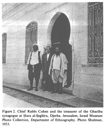 Encyclopaedia
                        Judaica: Jews in Tunisia, vol.15, col.1434:
                        Chief Rabbi Cohen and the treasurer of the
                        Gharība synagogue at Ḥara al-Ṣeghīra, Djerba.
                        Photo: Shulman, 1953