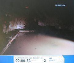 Water
                          basin in a tunnel system with tunnel caretaker
                          Heinz Rabe (left)