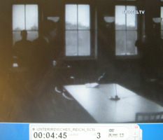 The speaker of the Nazi
                        leadership is taking a seat.