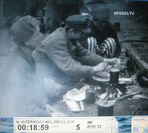 CC of
                          Dachau at the end of the war 07: a detainee
                          spooning his soup