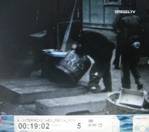 CC of Dachau at
                          the end of the war 08: a man searching a
                          barrel