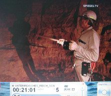 Doggerwerk near Hersbruck 08:
                          tunnel caretaker Heinz Rabe is pointing to
                          left drill holes