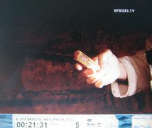 Doggerwerk near Hersbruck 13:
                          tunnel caretaker Rabe showing the explosive
                          cartridge