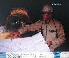 Doggerwerk near Hersbruck 16: tunnel
                          caretaker Heinz Rabe showing the plan 01