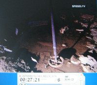 Kohnstein 18: tunnel with broken
                          parts from the rocket plant 03, a wheel on an
                          axis 02