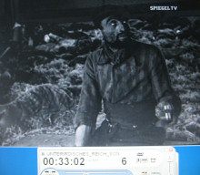 Kohnstein 49, well nourished
                        detainee sitting