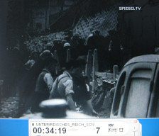 London 1944 03: search
                          groups going into the ruins