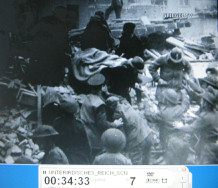 London 1944 09:
                          a person on a barrow is brought away, total
                          view