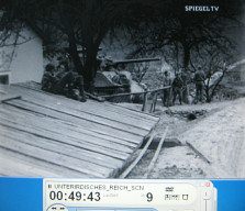 Ebensee 03, guard
                          at Ebensee with a tank in the background