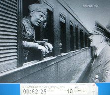 Wolfsschanze (Wolf's Lair)
                        03, Mussolini looking through the window of a
                        train, Hitler in front of it 02