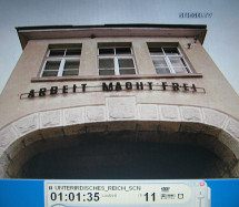 CC of Grossrosen 06, portal of
                        the main house with the inscription "Work
                        makes free"