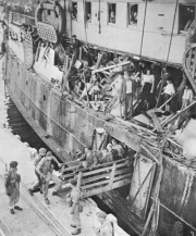 Ship SS Exodus with Jewish passengers
                          leaving on the docks in Palestine