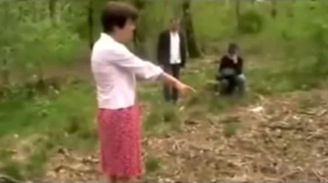 Holten (Holland):
                Toos Nijenhuis shows reporters the satanic pyre in the
                forest